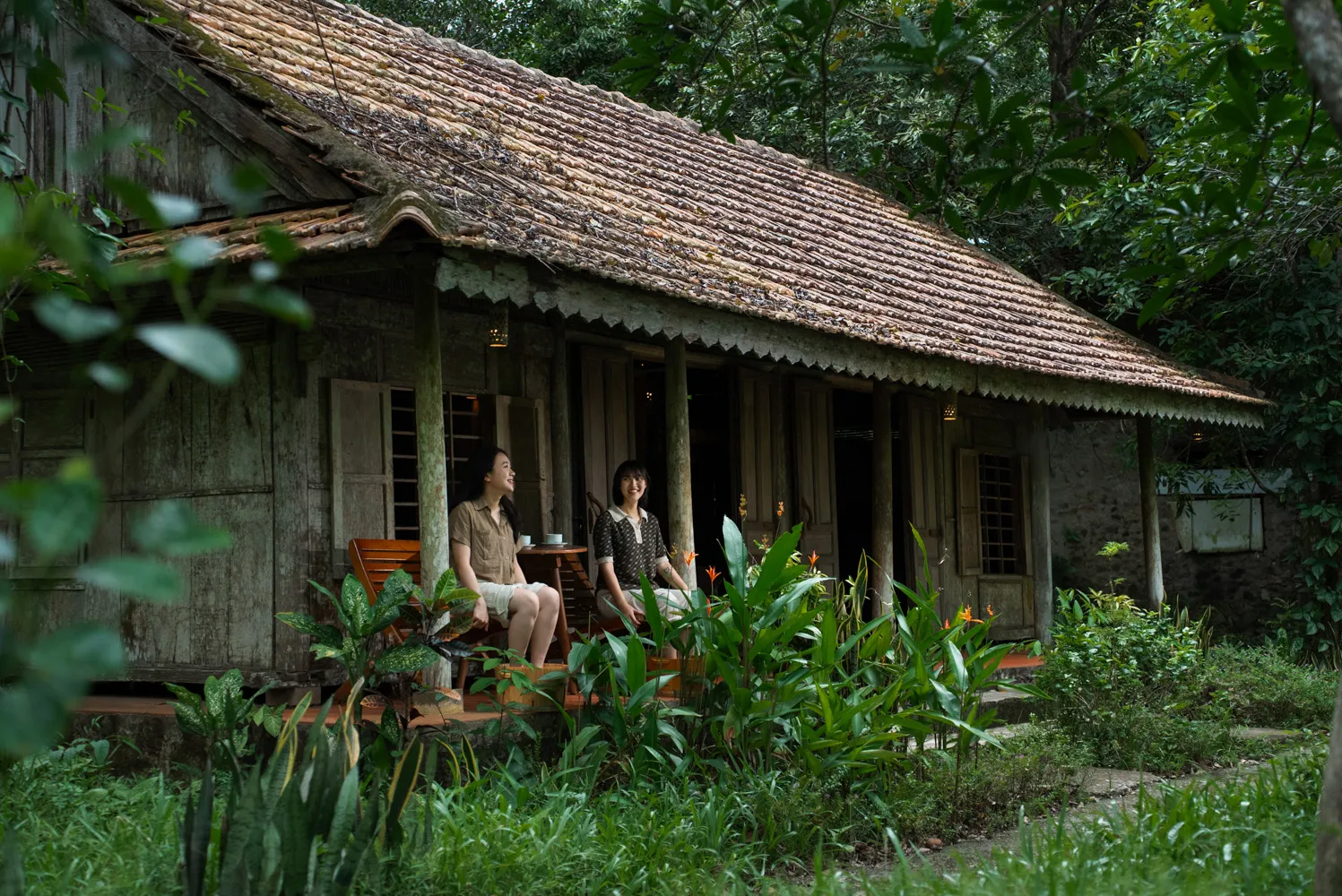The old-style wooden house surrounded by greenery is dedicated to welcoming spa visitors.